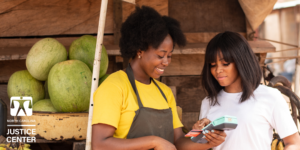 Black Women Equal Pay Day_Woman buying produce from farmer marketer.